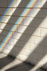 Poster - Diagonal Rainbow Light Beams on Brick Wall