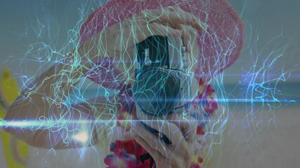 Poster - person in pink hat taking photo with electric light animation overlay
