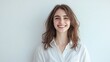 © WS Studio 1985 - Cheerful Young Woman in Casual Shirt Smiling Against White Background