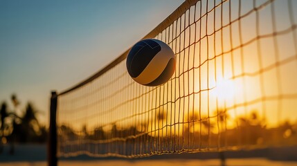 Poster - A volleyball in the air against a brightly lit outdoor background, with its shadow casting across the sand court.