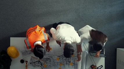 Poster - top view of smart architect and skilled civil engineer team working together to design building cons