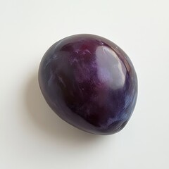 Poster - Fresh dark purple plum ready for tasting, showcasing its smooth skin and vibrant color