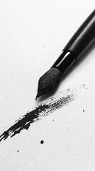 Poster - A black paintbrush making a stroke of ink on white paper