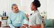 © peopleimages.com - Physiotherapist, woman and senior man with checklist, discussion and questions at clinic. People, clipboard and report for injury with talking, advice and medical assessment for wellness at hospital