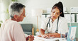 © peopleimages.com - Clipboard, healthcare or insurance with doctor and patient in office of hospital for consulting. Documents, feedback or medical with medicine professional and mature woman in clinic for diagnosis