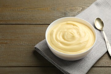 Wall Mural - tasty vanilla pudding served on wooden table. space for text