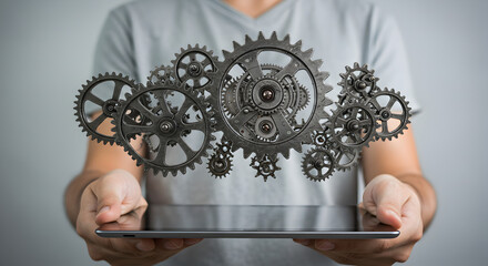 Poster - Man Holding Tablet with Gears Forming Cloud in Digital Technology Concept Presentation with Gray Background