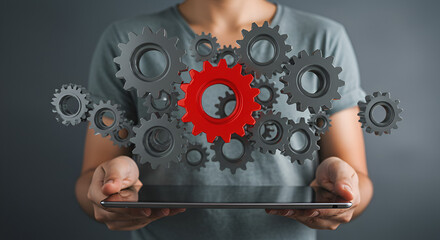 Poster - Person Holds Tablet with Floating Metal Gears and Cogs in Red and Silver on Gray Background