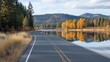 © Aku - Scenic lakeside road winding through autumnal forests and serene waters