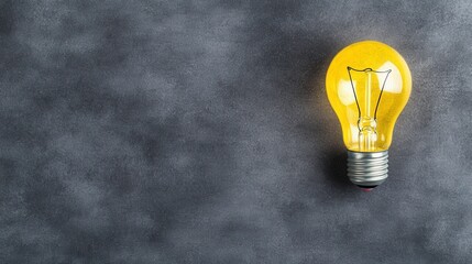 Poster - Yellow lightbulb on a dark gray textured background. The image is simple, clean, and conveys a sense of inspiration and new ideas.