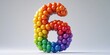 © Renat - Rainbow number 6 made of balloons. Festive volumetric figure on a light background. Birthday greeting card. Anniversary concept. Copy space.