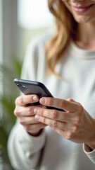 Poster - Woman using smartphone with a smile while sitting indoors, enjoying technology and connectivity, modern lifestyle concept