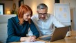 © Unlimited Resources - Office Setting with Two Colleagues Collaborating on Laptop, Man with Glasses and Woman with Red Hair in Business Casual Attire, Focused Expressions, Whiteboard in Modern Workspace