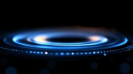 Aufkleber - Glowing blue spiral light rings on black background create futuristic technology effect with bokeh particles and motion blur for abstract design concept.