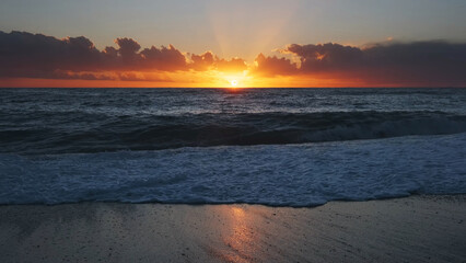 Wall Mural - sunset over sea with vibrant colors