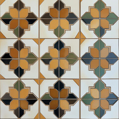 Poster - Colorful vintage ceramic tiles forming a beautiful floral pattern are decorating a wall