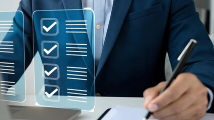 Poster - Man in suit working on laptop with checklist interface and writing on paper with pen on desk top