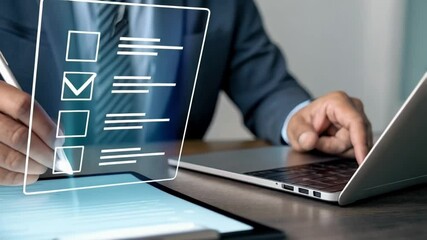 Poster - Person filling out digital checklist on tablet with laptop in background at desk in suit jacket