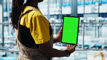 Poster - robotics technician using chroma key device in smart factory calibrating iot sensors, close up. engi