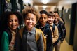 © Baba Images - Portrait of a diverse kids students in elementary school hallway with lockers