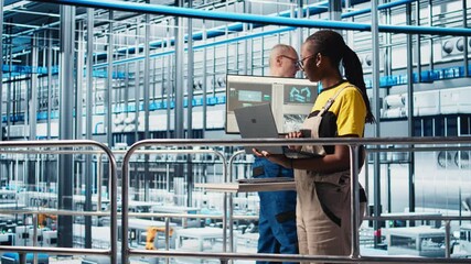 Poster - portrait of happy engineer in smart photovoltaics factory looking at system performance metrics. che