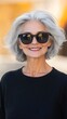 © ShadowHero - Mature woman with silver hair wearing oversized sunglasses, smiling confidently, timeless elegance, warm neutral background