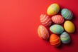 © kashif - Color-blocked Easter eggs on vibrant red background, top view