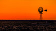 © Austockphoto - Windmill silhouette against an orange Sunset