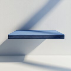 Aufkleber - Blue Wooden Shelf on Textured White Wall with Natural Light Casting Shadows, Simple and Minimalist Design