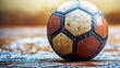 © best - Wet Soccer Ball on the Ground: A Close-Up Shot
