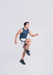 © Q88 - Portrait of healthy Asian man exercising on white background