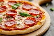 © Priya - Pepperoni pizza on wooden platter