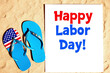 © AuraBloom - pair of flip flops with the words Happy Labor Day written on them