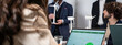 © Davide Zanin - Horizontal banner or header with business people working together on sustainable innovation project - Green renewable energy concept - Focus on laptop
