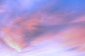 Wall Mural - Sky with soft and fluffy pastel orange pink and blue colored clouds. Sunset background. Nature. sunrise.