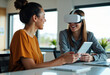© starush - Two women enjoying virtual reality experience in a modern office setting