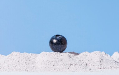 Poster - Dark Blue Galaxy Sphere on White Granular Pile