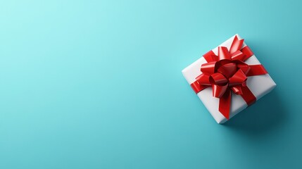 Poster - White gift box with a red ribbon bow on a light blue background. Simple, elegant presentation with copy space.