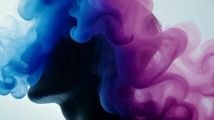 Poster - Colorful smoke swirls around silhouette creating a dramatic artistic effect in a studio setting