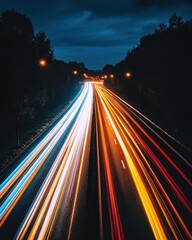Poster - Dynamic highway at night with light trails creating a vivid display of motion and energy under a dark sky aerial view