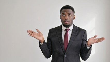 Poster - businessman gesturing during a meeting or presentation, dressed in a suit and tie