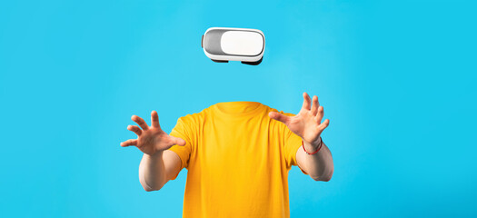 Poster - A user enjoys virtual reality using a headset, with no visible head or face. The individual hands reach out, exploring a modern digital experience against a bright blue background.