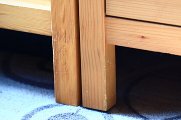 Poster - A detailed view of a wooden bed frame, ideal for interior design and home decor projects.