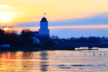 Poster - A serene lake scene with a tower visible in the distance, perfect for use in travel or architecture images.