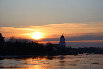 Poster - A serene sunset scene over calm waters.