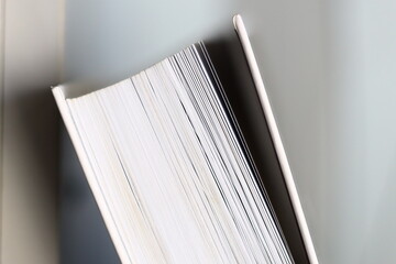 Poster - A close-up view of a book lying on a table.