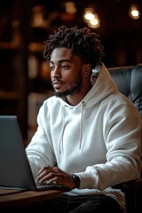 Poster - Young man working on a computer in a cozy modern office space