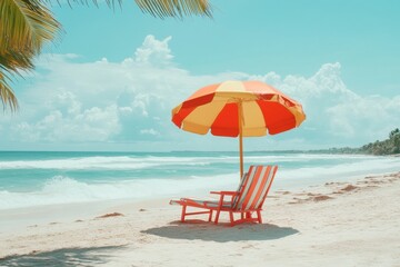 Fototapete - Colorful beach getaway with a striped sun lounger and bright umbrella by the ocean waves on a tropical summer day