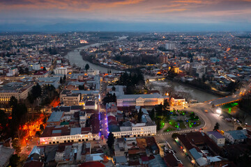 evening drone view of the ancient city of kutaisi, located on the two banks of the rioni river and a