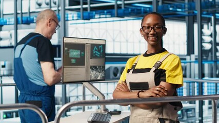 Poster - portrait of happy smart factory engineer working on predictive maintenance algorithms to enhance pro